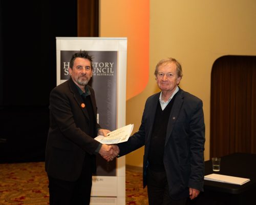 2026 Lifelong Historian Award winner, Dr Geoffrey Bishop, receiving his certificate from HCSA President, Prof. Matthew Fitzpatrick.