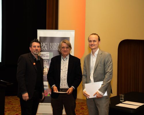 HCSA President Prof. Matthew Fitzpatrick, Michael Bollen of Wakefield Press, and winner of the 2026 Wakefield Press Essay Prize, Dr. Samuel Cox.